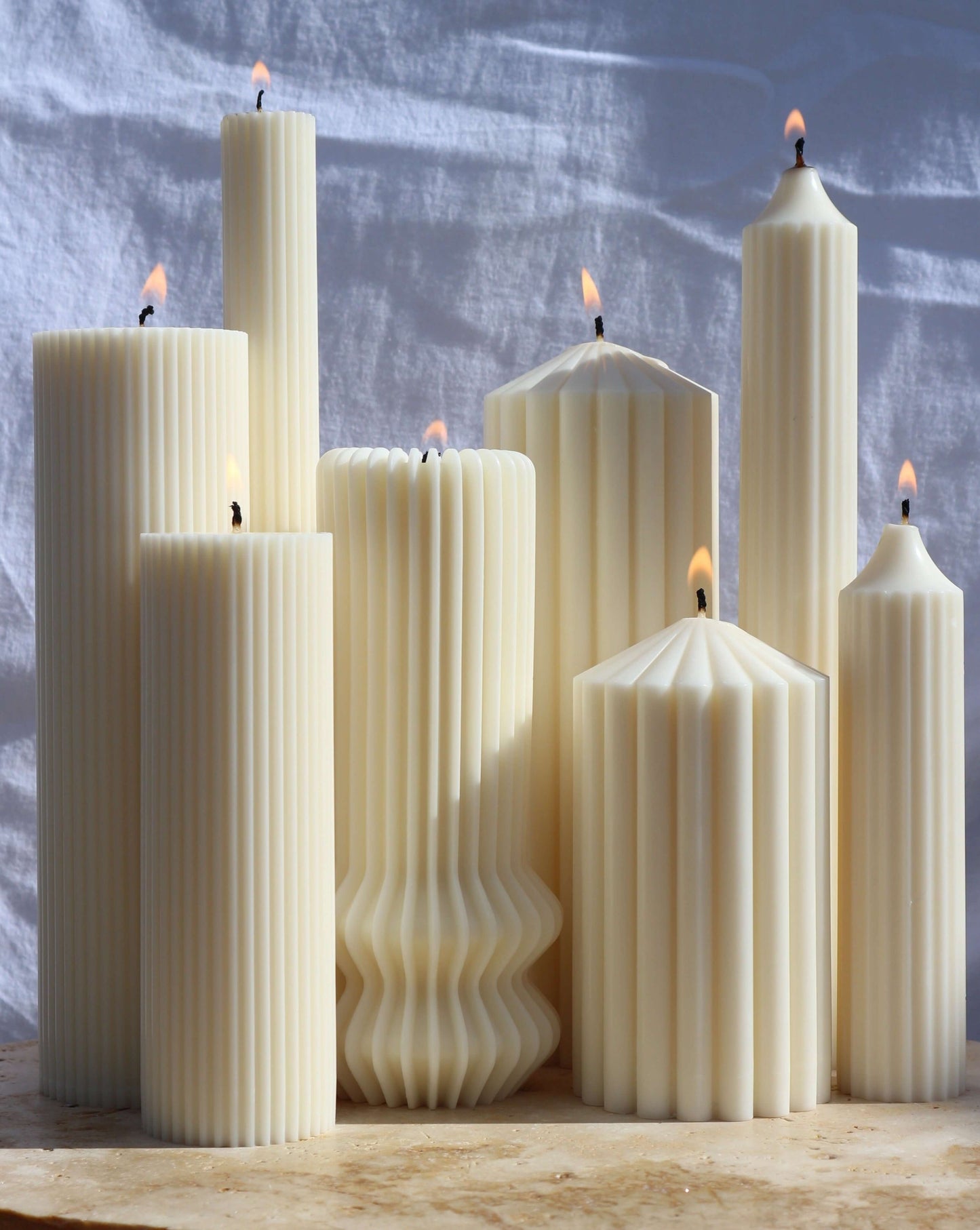 A Collection of Pillar Candles in an outdoor setting | Sculptural Candle Australia | Candle Decorations | Home Decorations | Bubble Candles | Free Standing Candles | Clean Candles | Sculptural Candles | Candles Australia | Scented Candles | Unscented Cand